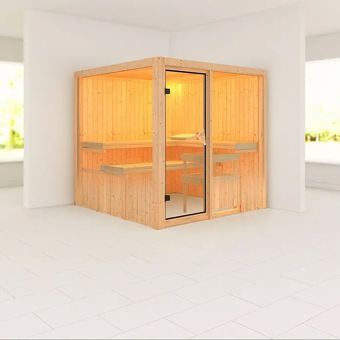 Karibu Elementsauna Rodin - Mit 9 kW Ofen mit externer Steuerung, Ohne Dachkranz, L x B x H: 196 x 196 x 192 cm - Innenaufnahme einer hellen, hölzernen Sauna mit Glasfront und Holzbänken, die zum Entspannen einlädt.