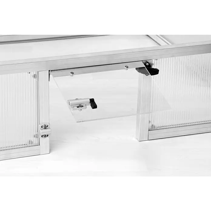 KGT Frühbeet Schildkröten-Unterbau 100 - 103 x 91 x 26 cm, Kunststoff, Silber - Detailaufnahme eines automatischen Fensteröffners für Gewächshäuser, der für Belüftung und Temperaturkontrolle sorgt.