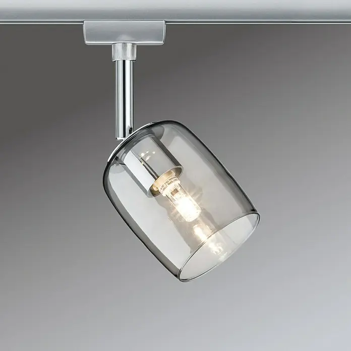Paulmann URail LED-Spot Blossom10 W, Chrom/Rauchglas, G9, 1 Stk. - Nahaufnahme einer schwenkbaren, grauen Glas-Deckenleuchte mit Chromhalterung und warmweißem Licht für eine elegante Atmosphäre.