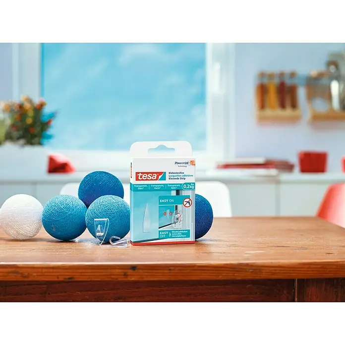 Tesa Powerstrips Cinta engomada - Transparente - Tesa Powerstrips tiras adhesivas para vidrio hasta 0,2kg, ideales para objetos decorativos transparentes. Fácil de colocar y quitar sin dejar residuos.