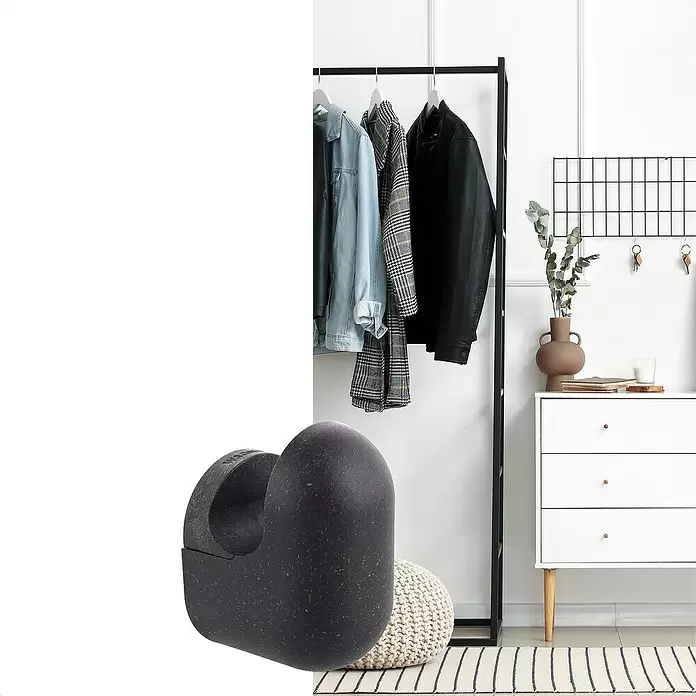 Wagner System Garderobenhaken PILL - L x B x H: 55 x 45 x 75 mm, Schwarz, 1 Stk. - Dunkler, gesprenkelter U-förmiger Halter in modernem Interieur, deutet auf stilvolle Organisation hin.