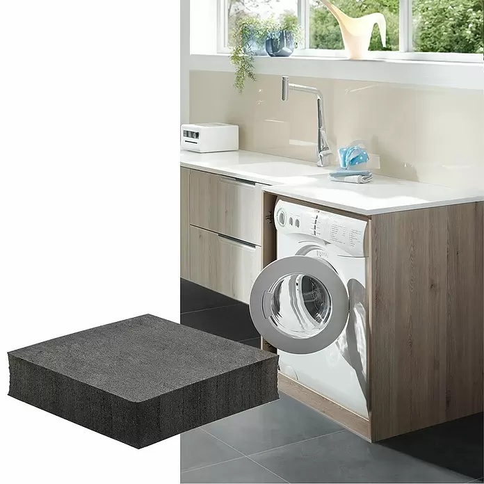Wagner System Vibrationsdämpfer - L x B x H: 50 x 50 x 12 mm, Schwarz, 2 Stk. - Dunkelgraue, dicke Antivibrationsmatte in einem Waschraum, teilweise eine Waschmaschine verdeckend.