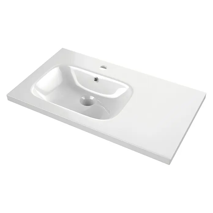 Lavabo Tritón - 46 x 81 cm, Orificios para grifo: Medio, Con desbordamiento, Blanco - Imagen de un lavabo de cerámica blanca con una superficie lisa y una depresión redonda para el desagüe.