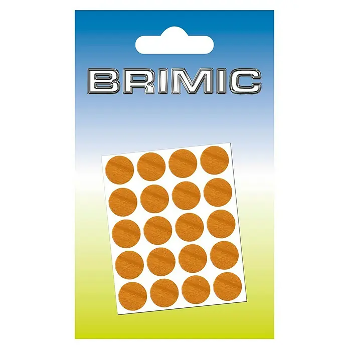 Micel Brimic Tapón embellecedor Cerezo claro - Diámetro: 13 mm, Pegado, 20 ud. - La imagen del producto muestra adhesivos con patrones de vetas de madera sobre una hoja de soporte, ideales para añadir acentos decorativos.
