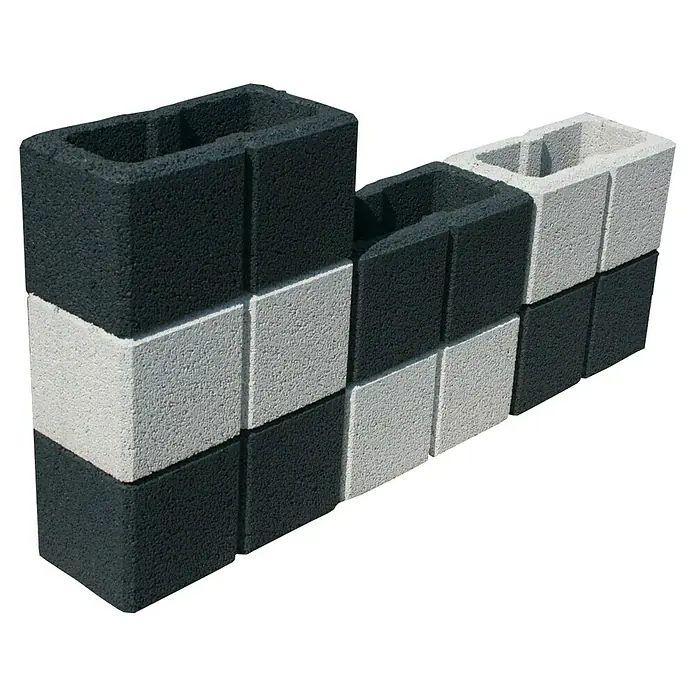 Christoph Gartenmauer Ambienta - 40 x 20 x 20 cm, Grau, Beton - Abgebildete sind schwarze und weiße Hohlblocksteine, die versetzt angeordnet sind, um ein dekoratives Mauerwerk zu bilden.