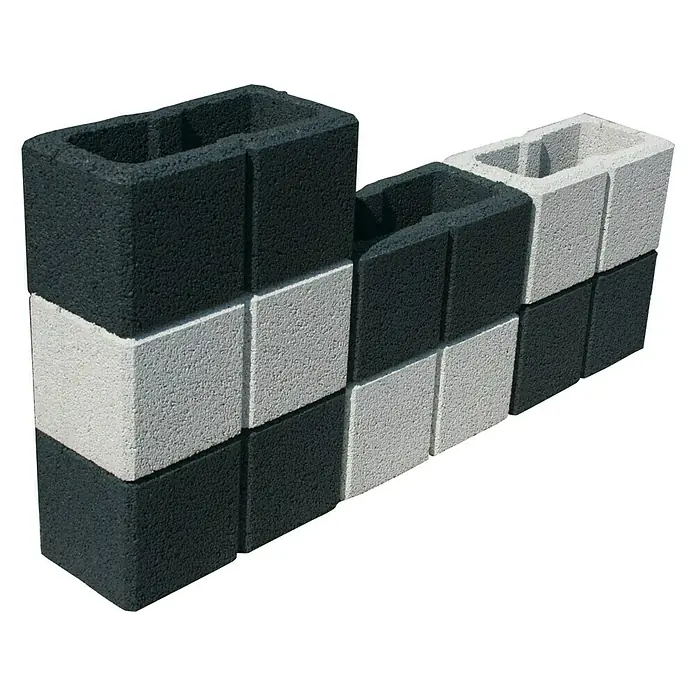 Christoph Gartenmauer Ambienta40 x 20 x 20 cm, Weiß, Beton - Abgebildete sind schwarze und weiße Hohlblocksteine, die versetzt angeordnet sind, um ein dekoratives Mauerwerk zu bilden.