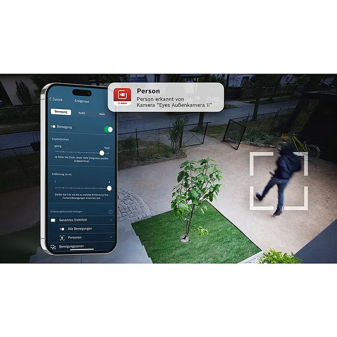Bosch Smart Home Überwachungskamera Eyes II -  - Bosch-Überwachungskamera mit Personenerkennung. Zeigt die zugehörige App mit Benachrichtigung und Live-Aufnahme einer Person im überwachten Bereich.