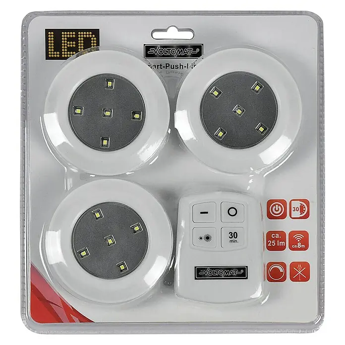 Voltomat Luz a pilas Smart-Push-Light - Blanco, 3 ud. - La imagen muestra un juego de tres luces LED con control remoto de VOLTOMAT en un paquete de plástico transparente.
