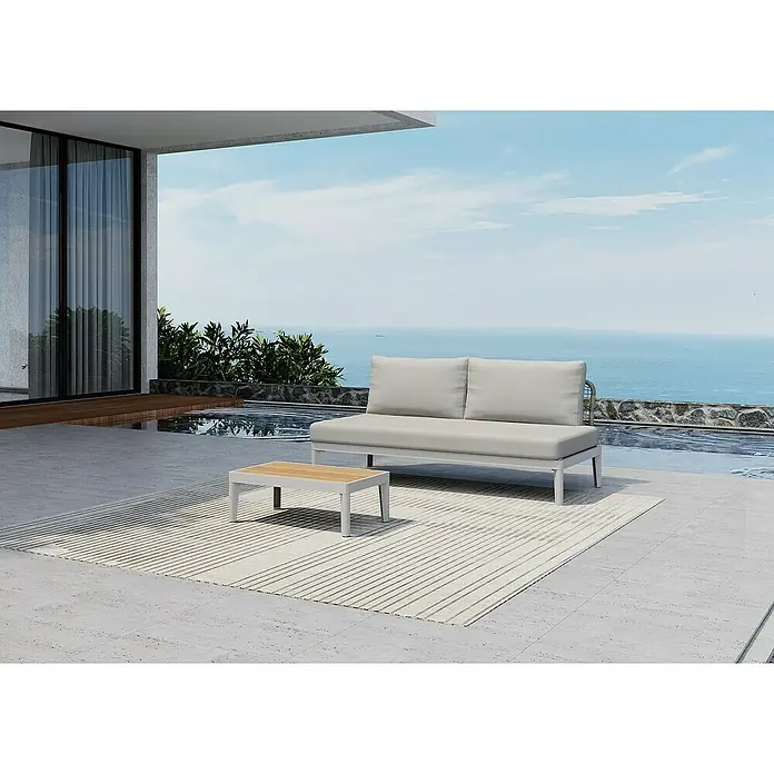 Sunfun Loungemöbel-Set Solo Rope XII - 2 -tlg., Aluminium/Kunststoff/Olefin, Light-Greige - Ein moderner grauer Outdoor-Bereich mit einem Sofa, einem Couchtisch und einem gestreiften Teppich auf einer Terrasse mit Meerblick.