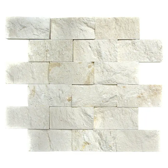 Mosaikfliese Brick Splitface Colonial X3D 49792 - 30,5 x 29 cm, Weiß, Matt - Ein Bild von einer Wandverkleidung aus weißen Natursteinen mit einer schönen Textur, die sich ideal für eine moderne und elegante Raumgestaltung eignet.
