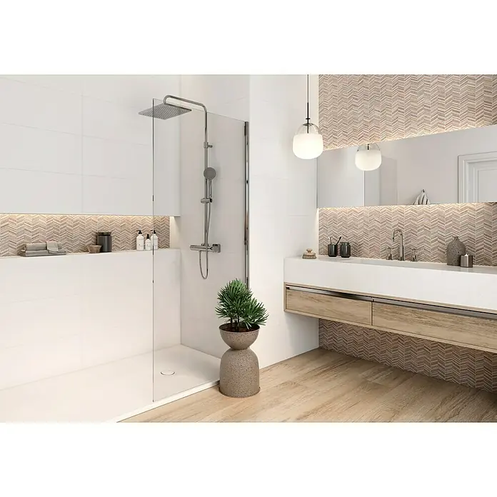 Revestimiento de pared Montreal - 30 x 90 cm, Blanco, Mate, Rectificado - Elegante baño con lavabo blanco y detalles en madera, resaltado por una cabina de ducha con accesorios cromados y una maceta con una planta decorativa.