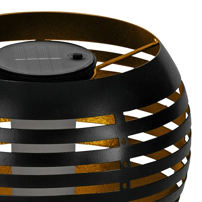 Eglo Lámpara de sobremesa solar Z_ Solar - 12 W, Negro - Primer plano de una elegante lámpara solar negra y dorada, perfecta para crear un ambiente acogedor al aire libre.