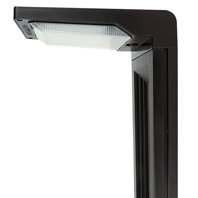 Arte confort Baliza exterior LED solar Altair - Blanco frío - Primer plano de una farola negra con una pantalla alargada y transparente. Emite una luz brillante, ideal para iluminar espacios exteriores.