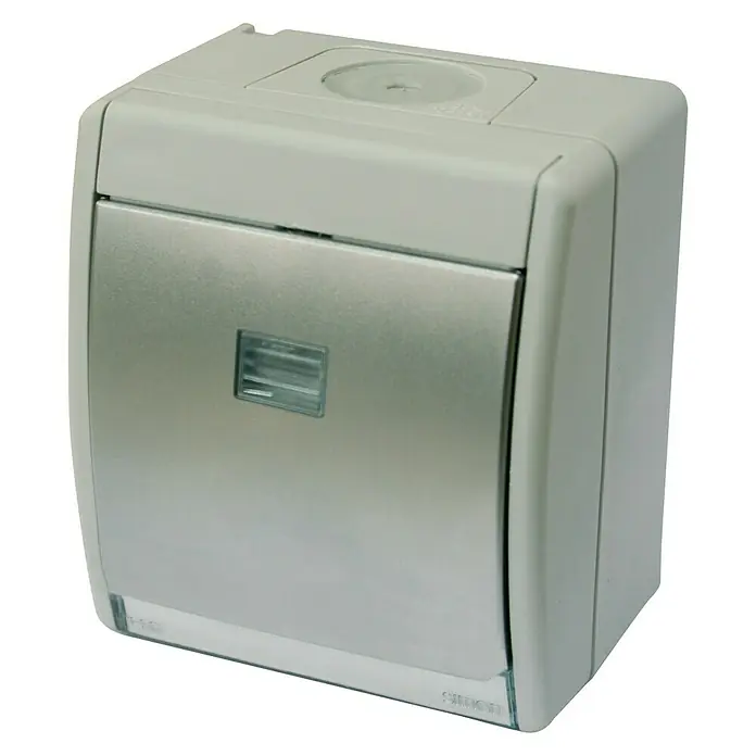 Simon Conmutador con luz - Gris, Mate, Montaje en superficie - Primer plano de una caja de conexiones Simon, ideal para instalaciones eléctricas. Práctica y robusta para uso interior.