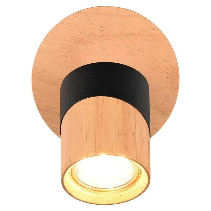 Trio Lighting Aruni Foco de pared - 10 W, L x An x Al: 15 x 11 x 13 cm, Negro/Marrón, GU10 - Primer plano de una moderna lámpara de techo de madera con un acento negro, que emite un brillo cálido. El diseño simple resalta la veta natural de la madera.