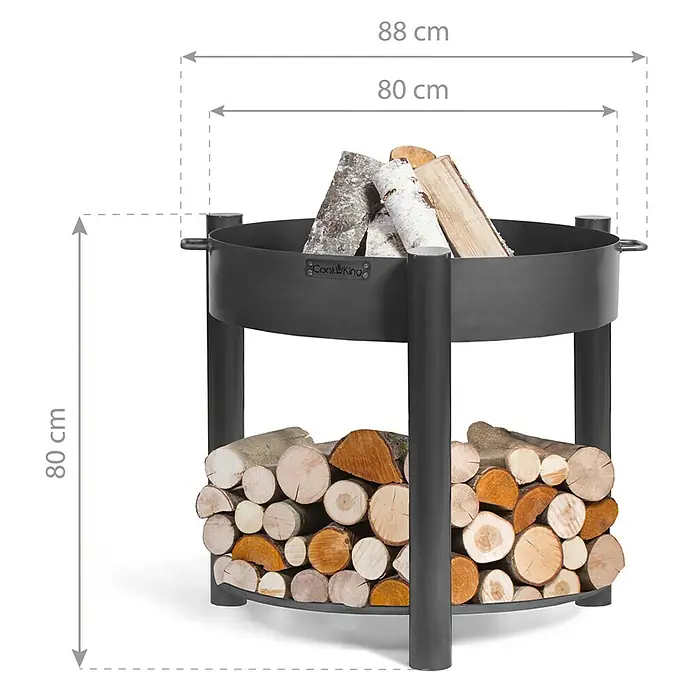 CookKing Feuerschale Montana - Ø x H: 88 x 80 cm, Stahl - Schwarze Metall-Feuerschale (88 cm breit, 80 cm hoch) mit integriertem Holzregal, gefüllt mit Brennholz.