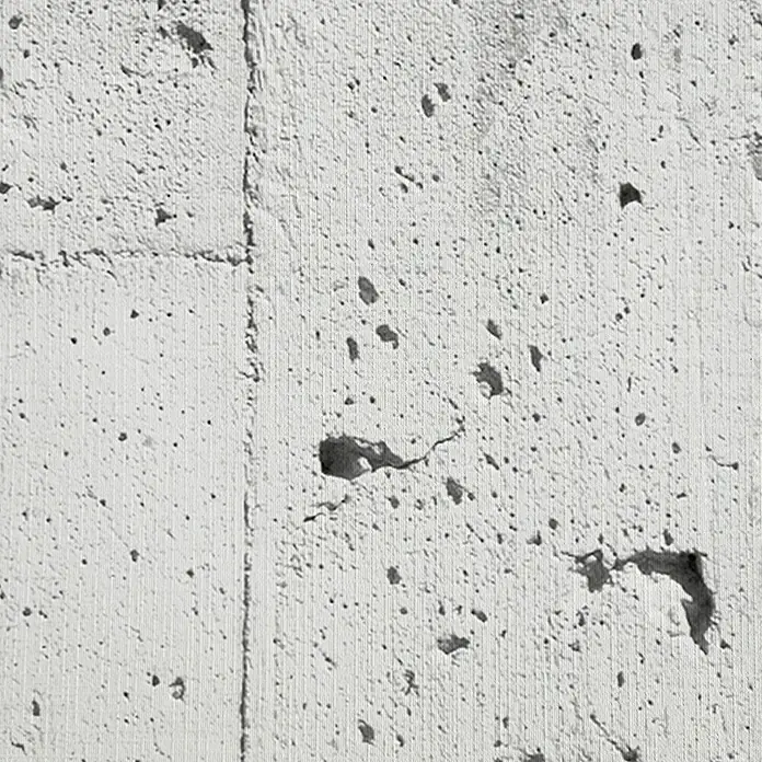 Lámina decorativa autoadhesiva vinílico Premium - 90 x 280 cm, Encofrado, Gris - Primer plano de una pared de hormigón con una estructura porosa. La superficie muestra finas líneas y agujeros irregulares.