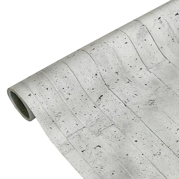 Lámina decorativa autoadhesiva vinílico Premium - 90 x 280 cm, Encofrado, Gris - Primer plano de un rollo de papel pintado de hormigón con una superficie rugosa y texturizada y un aspecto de hormigón realista.