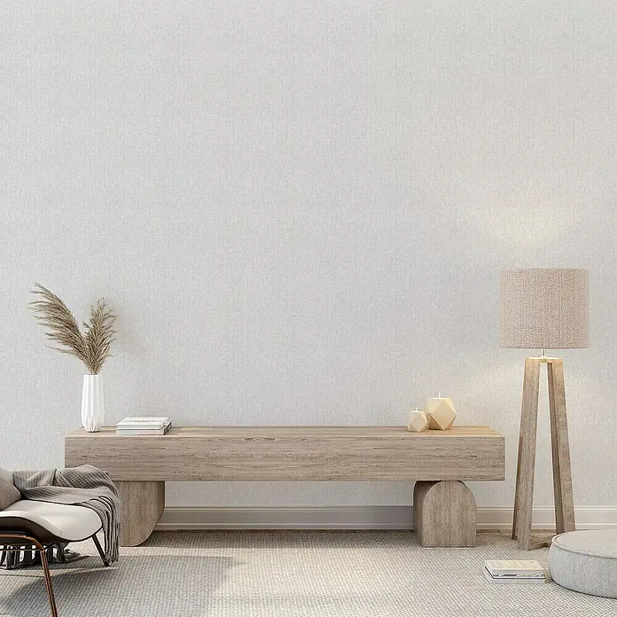 Lámina decorativa autoadhesiva vinílico Premium - 90 x 280 cm, Lienzo, Gris - La imagen muestra un interior minimalista con un aparador de madera, una lámpara de pie y elementos decorativos.