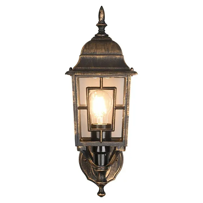 Trio Lighting Aplique exterior Volturno - 60 W, 19 x 15 x 41 cm, Bronce, IP44 - Primer plano de una lámpara de pared dorada de estilo vintage con bombilla sobre un fondo negro para iluminación ambiental.