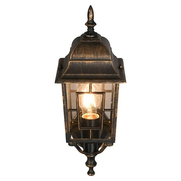 Trio Lighting Aplique exterior Volturno - 60 W, 19 x 15 x 41 cm, Bronce, IP44 - Primer plano de una lámpara de pared de estilo vintage con una bombilla incandescente dentro de un recinto metálico negro y dorado.