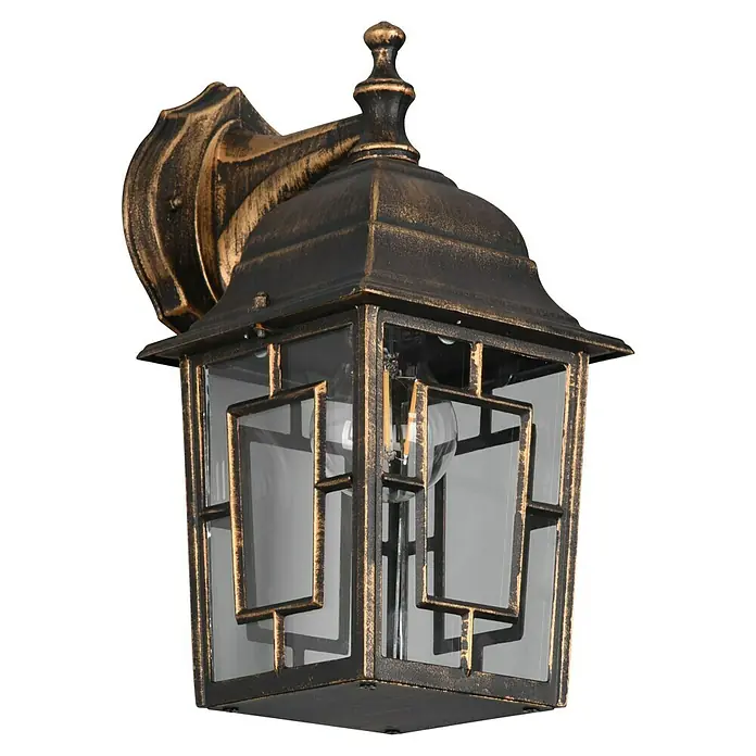 Trio Lighting Aplique exterior Volturno - 60 W, 19 x 15 x 30 cm, Bronce, IP44 - Primer plano de una elegante lámpara de pared de estilo vintage en bronce, creando un ambiente atmosférico con su diseño clásico y luz suave.