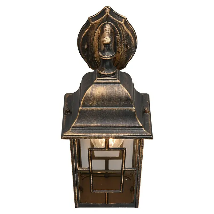 Trio Lighting Aplique exterior Volturno - 60 W, 19 x 15 x 30 cm, Bronce, IP44 - Una foto de cerca de una elegante lámpara de pared rústica con un aspecto antiguo que crea un ambiente cálido y acogedor.