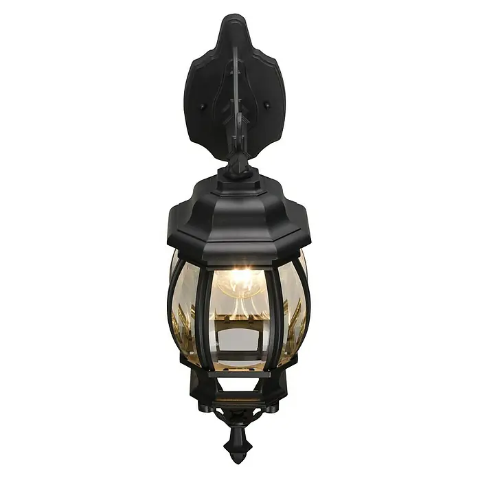 Trio Lighting Aplique exterior Elvo descendente - 60 W, 24 x 18 x 49 cm, Negro, IP44, Descendente - Primer plano de una lámpara de pared exterior negra estilo linterna con detalles decorativos y un cálido resplandor.