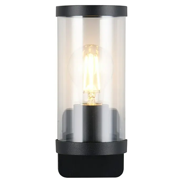 Trio Lighting Aplique exterior Bonito - 28 W, 9 x 9 x 23 cm, Negro, IP44 - Primer plano de una moderna lámpara de exterior con vidrio cilíndrico transparente y una bombilla de luz cálida.