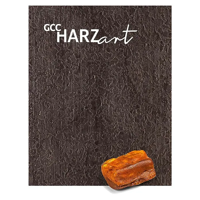 WPC-Terrassendiele Artwood - 300 x 12 x 2,8 cm, Grau - GCC HARZart Produktbild. Ein braunes Material mit einer steinartigen Textur und dem Schriftzug GCC HARZart darauf.