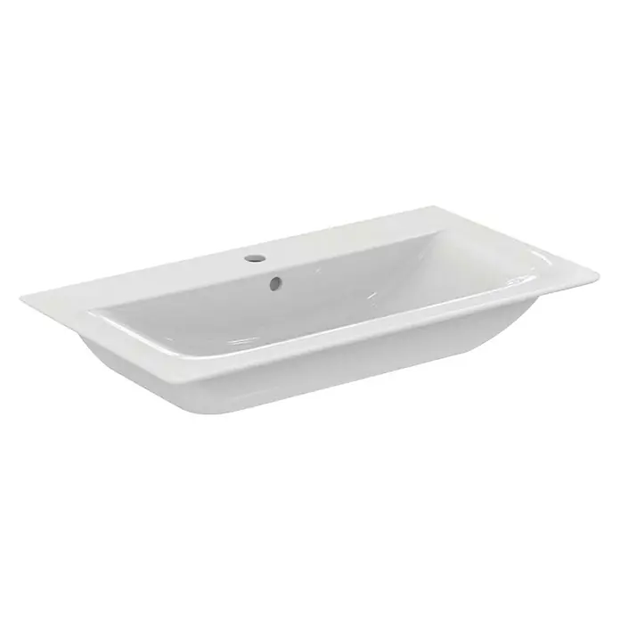 Ideal Standard Connect Air Einbauwaschbecken - 84 x 46 cm, Ohne Spezialglasur, Hahnloch: Mitte, Mit Überlauf, Weiß - Nahaufnahme eines weißen Keramikwaschbeckens mit rechteckiger Form und glatter Oberfläche für das Badezimmer.