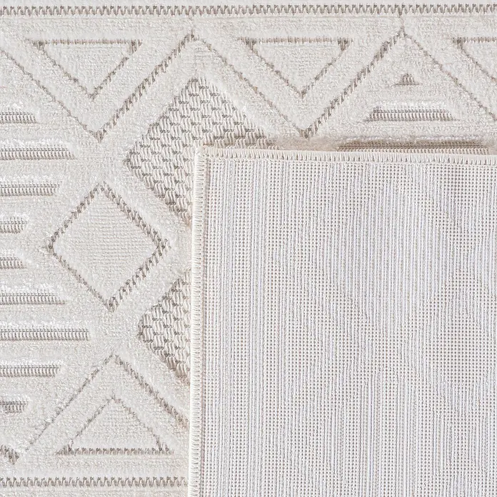 Kurzflorteppich Doha 1652 - Creme, 170 x 120 cm, 100 % Polypropylen - Nahaufnahme eines gemusterten Teppichs mit geometrischen Formen in neutralen Farben, der eine subtile Eleganz ausstrahlt.