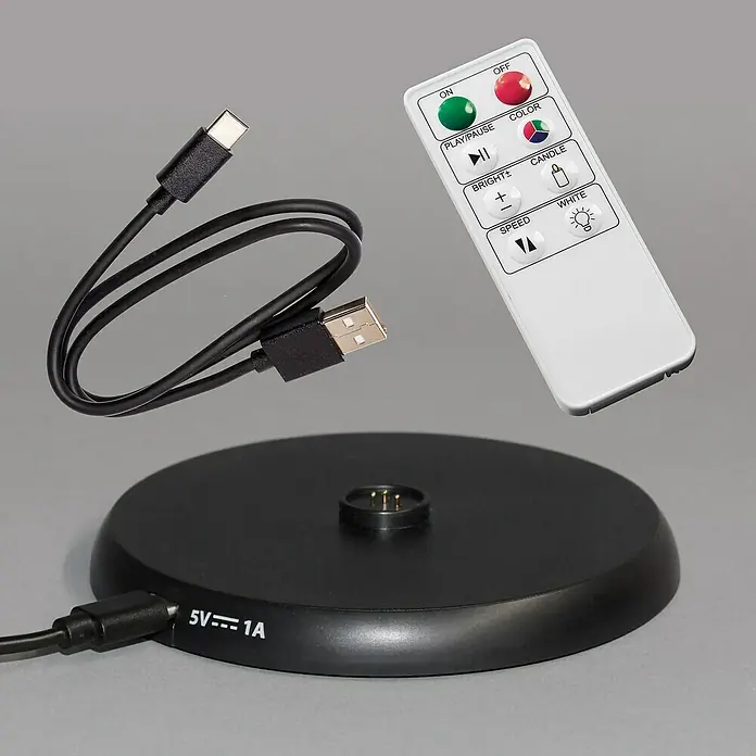 FHL easy Ladestation Super Charger - 1 Ladeplatz, L x B x H: 11 x 11 x 1 cm - Eine schwarze 5V/1A Ladestation mit USB-C-Kabel und eine weiße Fernbedienung.