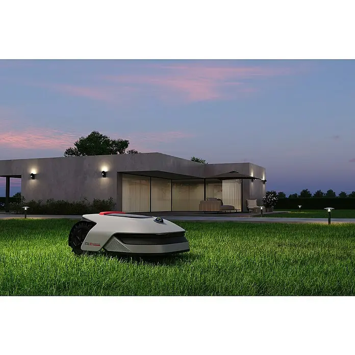 Dreame Mähroboter A1 Pro - 2.000 m², Schnittbreite: 22 cm, Laser-gestützte Navigation, LiDAR - Automatischer Rasenmäher auf Rasen vor einem modernen Haus im Abendlicht. Präzise Rasenpflege mit dem Mähroboter.