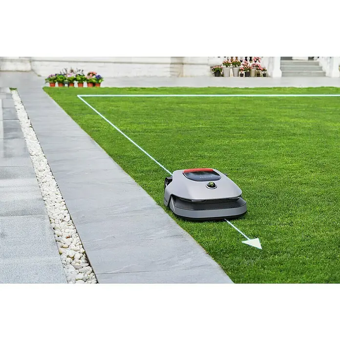 Dreame Mähroboter A1 Pro - 2.000 m², Schnittbreite: 22 cm, Laser-gestützte Navigation, LiDAR - Der Dreame A1 Mähroboter auf Rasen, begrenzt durch einen hellen Pfad. Er mäht präzise und effizient, für einen stets gepflegten Garten.