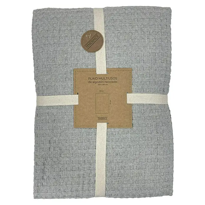 Manta para sofá Multiusos Waffle - Textil, Gris - Colcha gris de algodón reciclado atada con cintas con una etiqueta que indica la marca y las dimensiones.