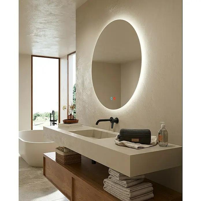 LedImex Espejo con luz Lisboa - Diámetro: 70 cm, Sensor, Función antivaho - Baño luminoso con espejo redondo y tocador moderno. La atención se centra en el diseño elegante del espejo retroiluminado en la habitación.