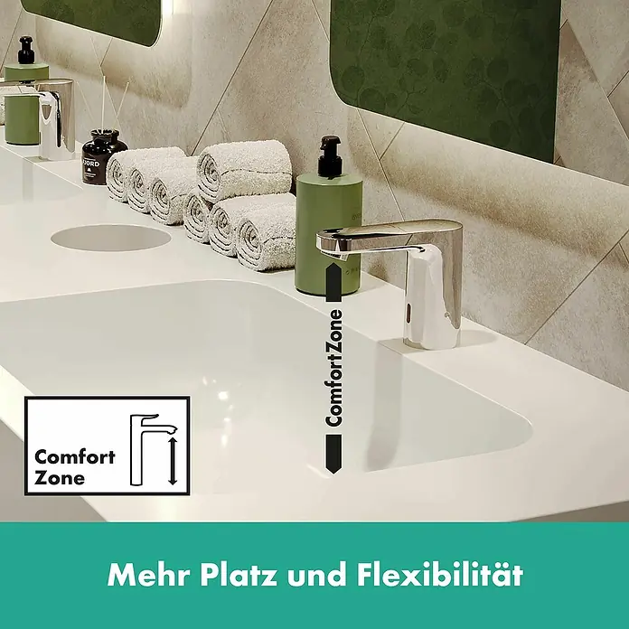 Hansgrohe Vernis Blend Kaltwasser-Standventil - Chrom, Betrieb über 230 V Netzanschluss - Bild eines modernen, automatischen Wasserhahns auf einem Waschbecken mit dem Hinweis auf die "ComfortZone" für mehr Flexibilität.
