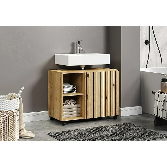Trendteam Niklas Waschtischunterschrank - B x T x H: 80 x 42 x 64 cm, Evoke Eiche, Strukturiert - Ein Waschtischunterschrank aus hellem Holz mit Stauraum und Rollenfüßen. Die weiße Waschbeckenplatte ist schlicht und modern gestaltet.