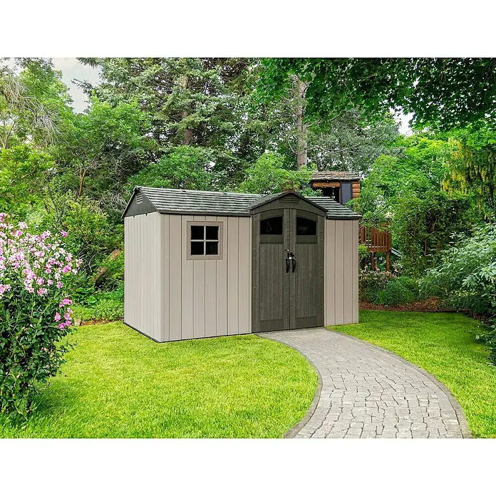 Lifetime Gerätehaus Pluto - Außenbreite inkl. Dachüberstand: 356 cm, Außentiefe inkl. Dachüberstand: 213,1 cm, Kunststoff, Grau - Zweifarbiger Kunststoff-Geräteschuppen mit hellbeigen Wänden und dunkelgrauem Dach/Türen, auf Rasen mit gepflastertem Weg.
