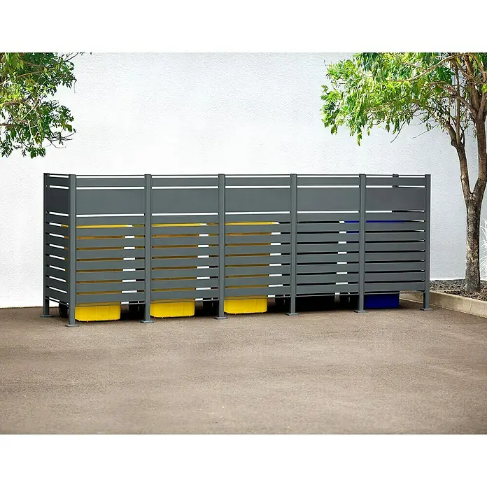 Westmann Mülltonnenbox Verkleidung Planum - 90 x 410 x 150 cm, Anthrazit - Mülltonnenbox aus grauem Metall mit gelben und blauen Behältern zur Mülltrennung, die eine saubere und ordentliche Umgebung fördert.