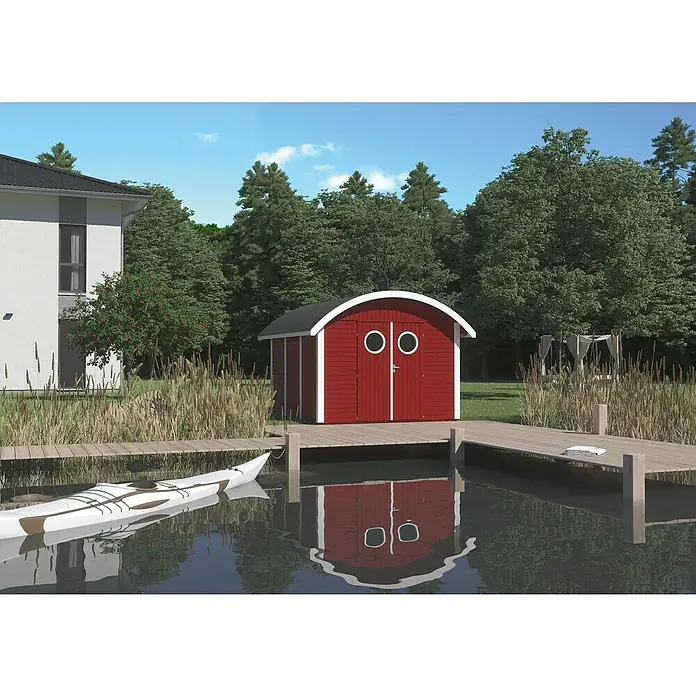 Joda Gerätehaus Rerik - Außenmaß inkl. Dachüberstand (B x T): 341 x 350 cm, Holz, rot / weiß grundiert - Blick auf ein rotes Gartenhaus mit Bullaugen und einem Paddelboot am See, das eine maritime und entspannende Atmosphäre schafft.