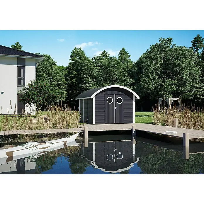 Joda Gerätehaus Rerik - Außenmaß inkl. Dachüberstand (B x T): 341 x 350 cm, Holz, Anthrazit / weiß grundiert - Stilvolles Gartenhaus mit abgerundetem Dach und zwei Bullaugenfenstern am Ufer eines Sees mit Steg und Kanu im Vordergrund.