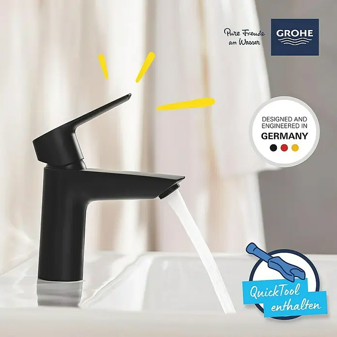 Grohe Start Waschtischarmatur S-Size - Ausladung Armatur: 109 mm, Matt, Schwarz - Schwarzer Grohe Wasserhahn mit fließendem Wasser in einem Waschbecken.
