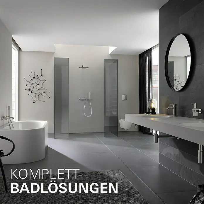 Grohe Essence New Waschtischarmatur S-Size - Ohne Zugstange, Supersteel, Matt - Elegantes Badezimmerdesign mit freistehender Badewanne, ebenerdiger Dusche und modernem Waschtisch mit rundem Spiegel.