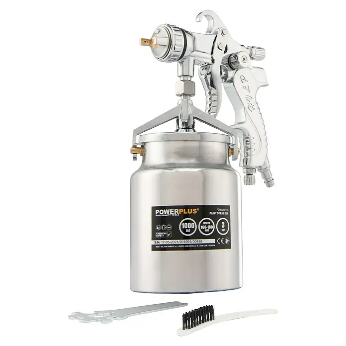 PowerPlus Pistola de pintura neumática POWAIR0110 - Presión de funcionamiento: 3 bar, Volumen de recipiente: 1.000 ml - Primer plano de una pistola de pintura POWERPLUS con accesorios, ideal para una aplicación precisa de pintura.