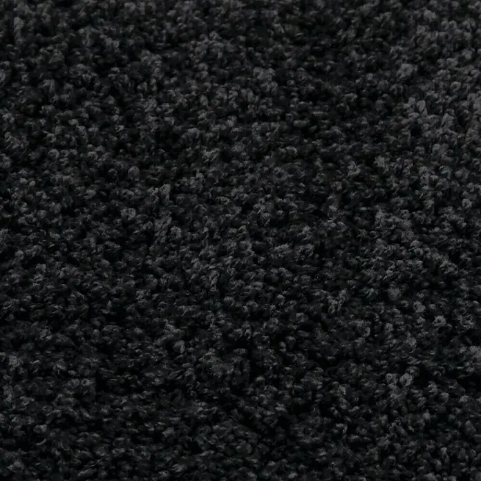 Teppichfliese Amazing - Hochflor, 100 % Polyester, Anthrazit - Nahaufnahme eines schwarzen, texturierten Teppichs, der eine weiche und einladende Oberfläche zeigt. Ideal für gemütliche Wohnräume.