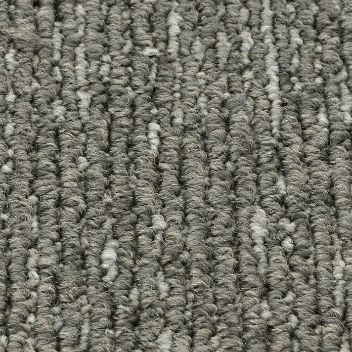 Teppichfliese Emotion - Schlinge, 100 % Polyamid SDN, Grau - Nahaufnahme eines robusten, grauen Teppichs mit einer ungleichmäßigen Textur, ideal für stark frequentierte Bereiche.