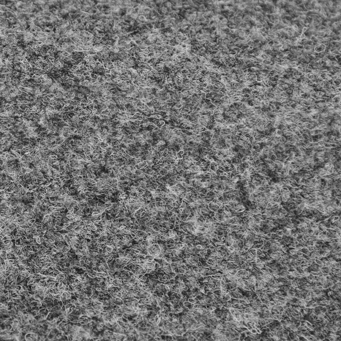 Teppichfliese Lindau - Nadelfilz, 100 % Polypropylen, Grau - Nahaufnahme von grauem Teppichboden, der eine dichte, gewundene Textur aufweist und ideal für Textil-, Bodenbelags- oder Hintergrundanwendungen ist.