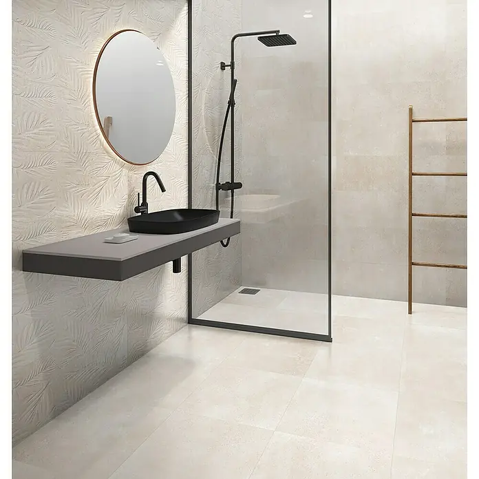 Revestimiento de pared Amira - 30 x 90 cm, Beige, Rectificado - Un baño elegante con un tocador moderno con un lavabo negro, un espejo redondo y una ducha a ras de suelo.